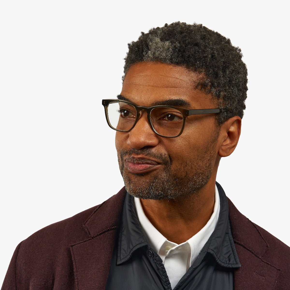 Person wearing Bornholm Shiny Olive reading glasses