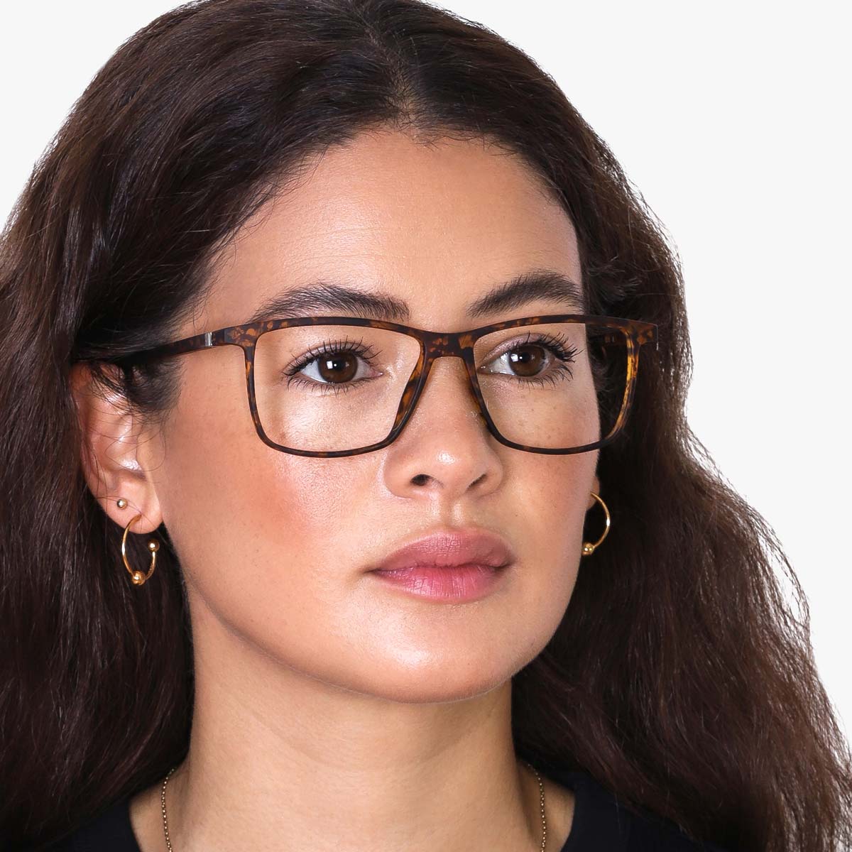 Person wearing København Light Turtle glasses with tortoise shell pattern