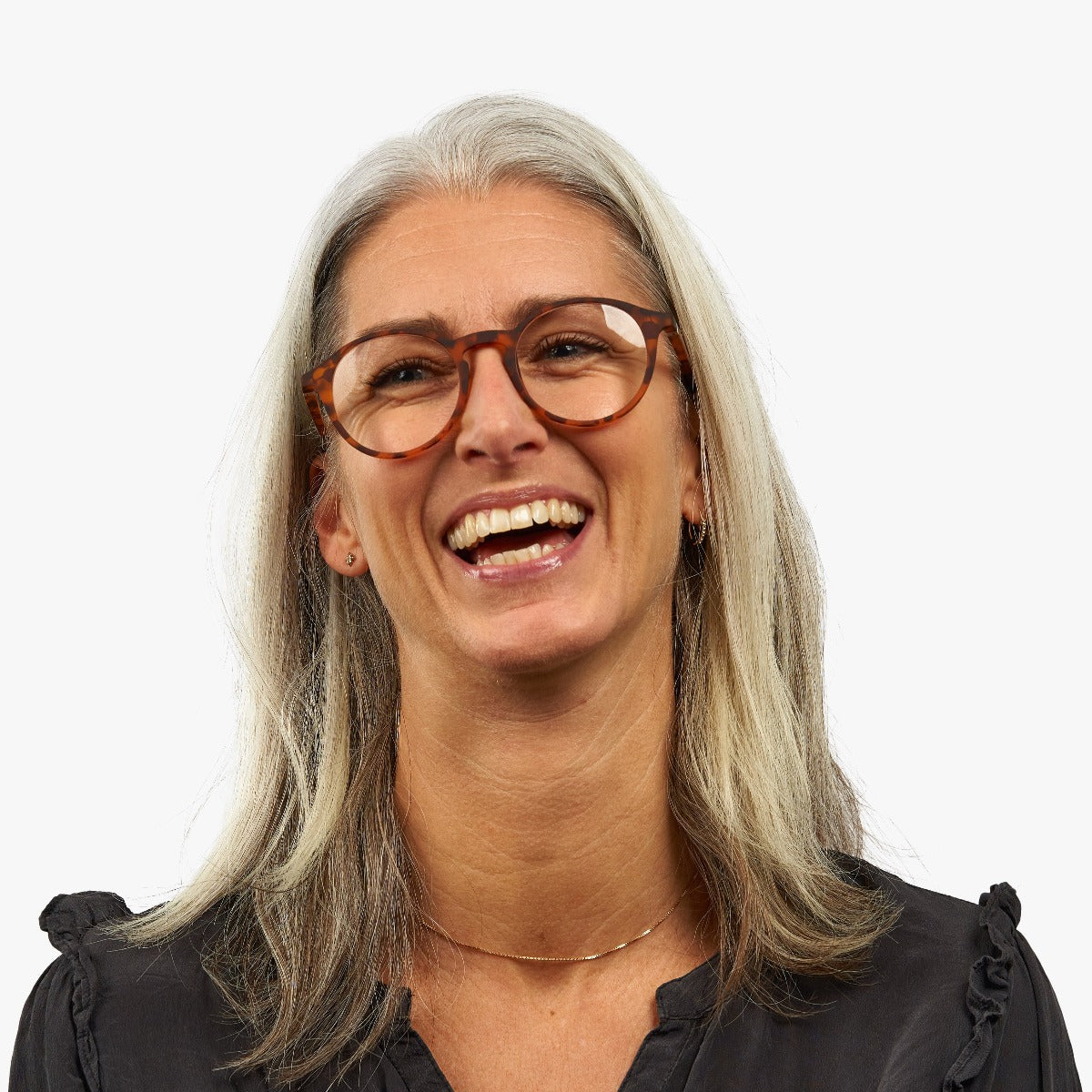 Person wearing Læsø Turtle glasses with tortoiseshell frame