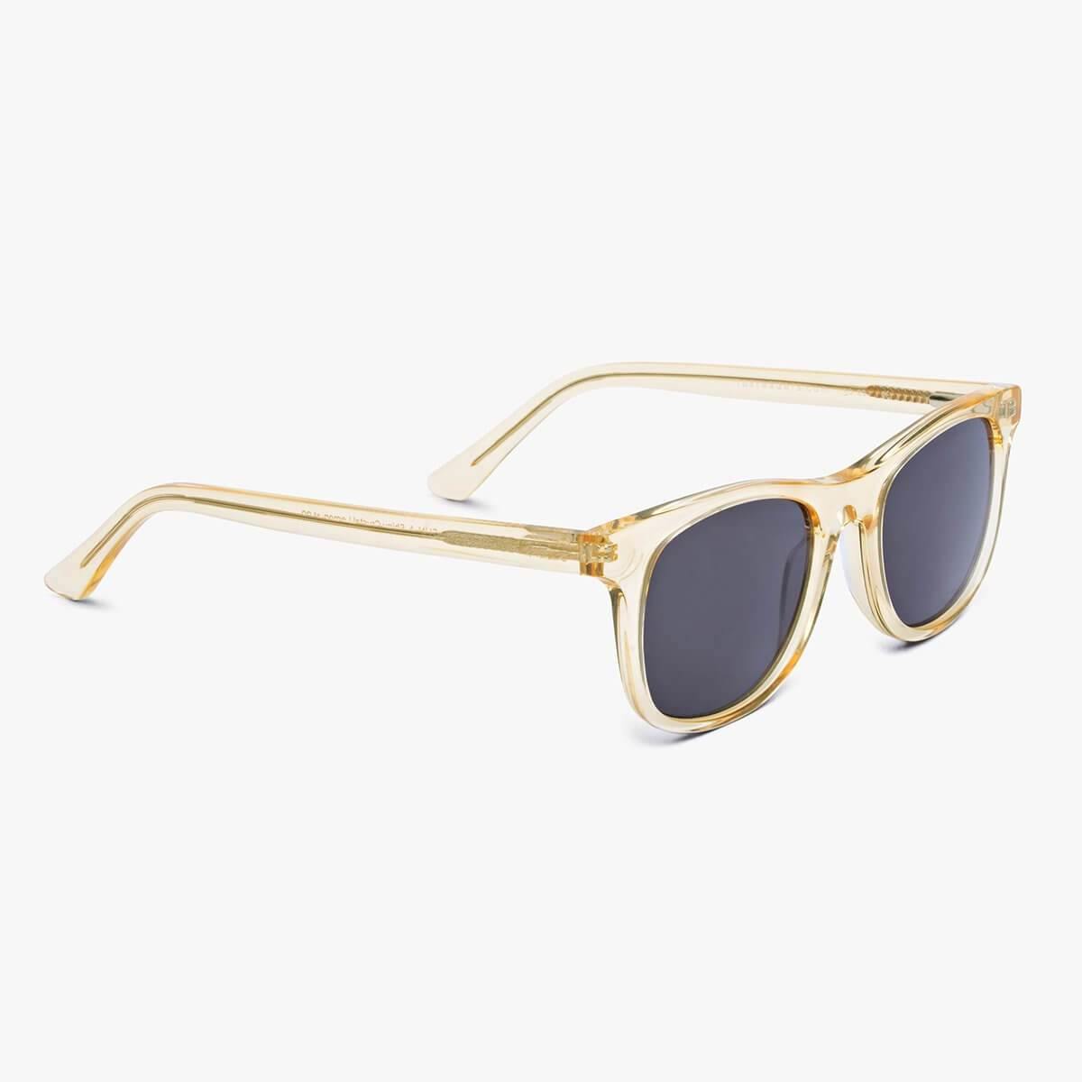 Malmö Crystal Lemon sunglasses with translucent yellow frames and dark lenses