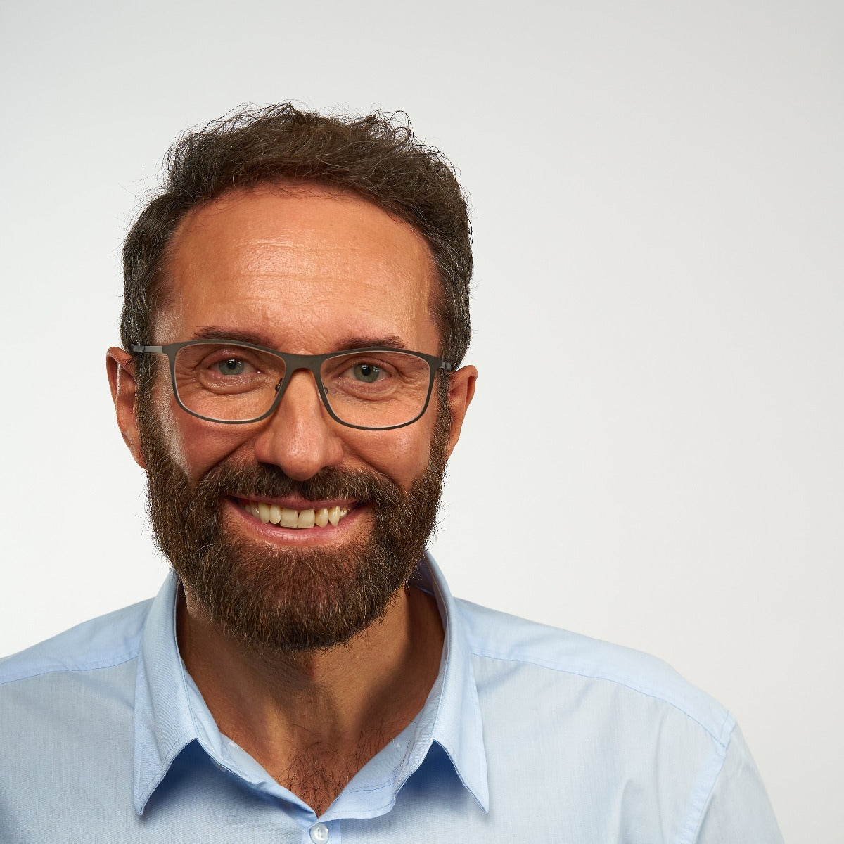 Person wearing Skagen Black reading glasses