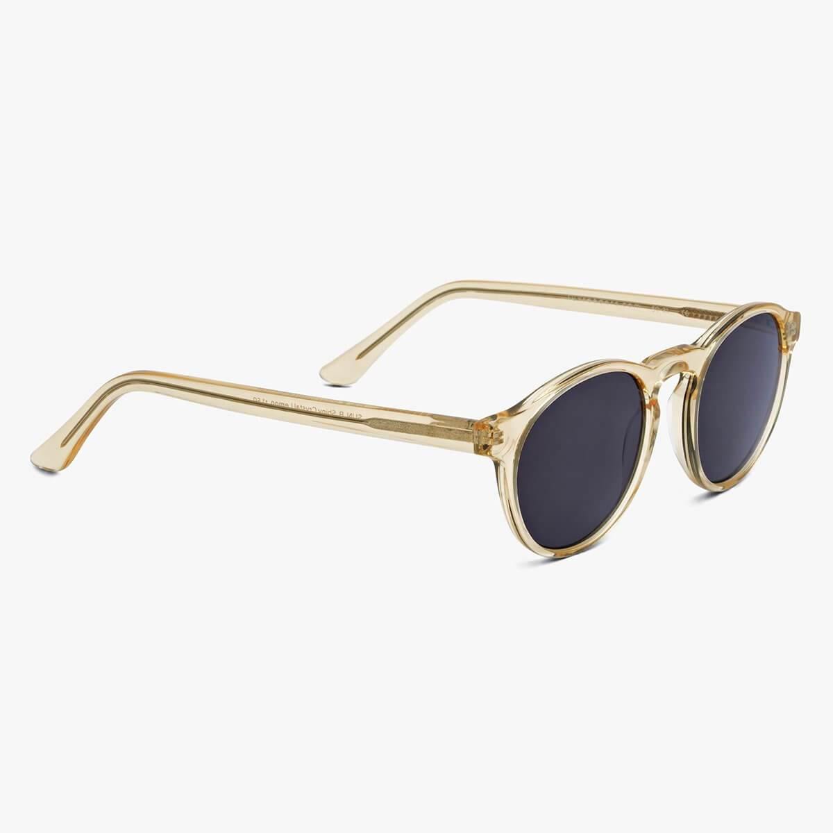 Round crystal lemon sunglasses with dark lenses and gold temples