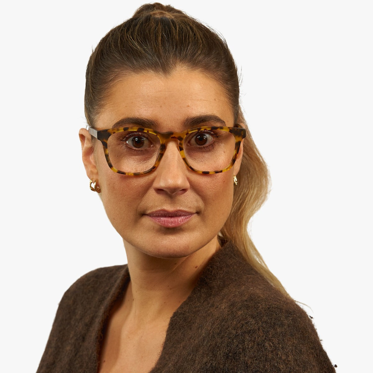 Person wearing tortoiseshell eyeglasses