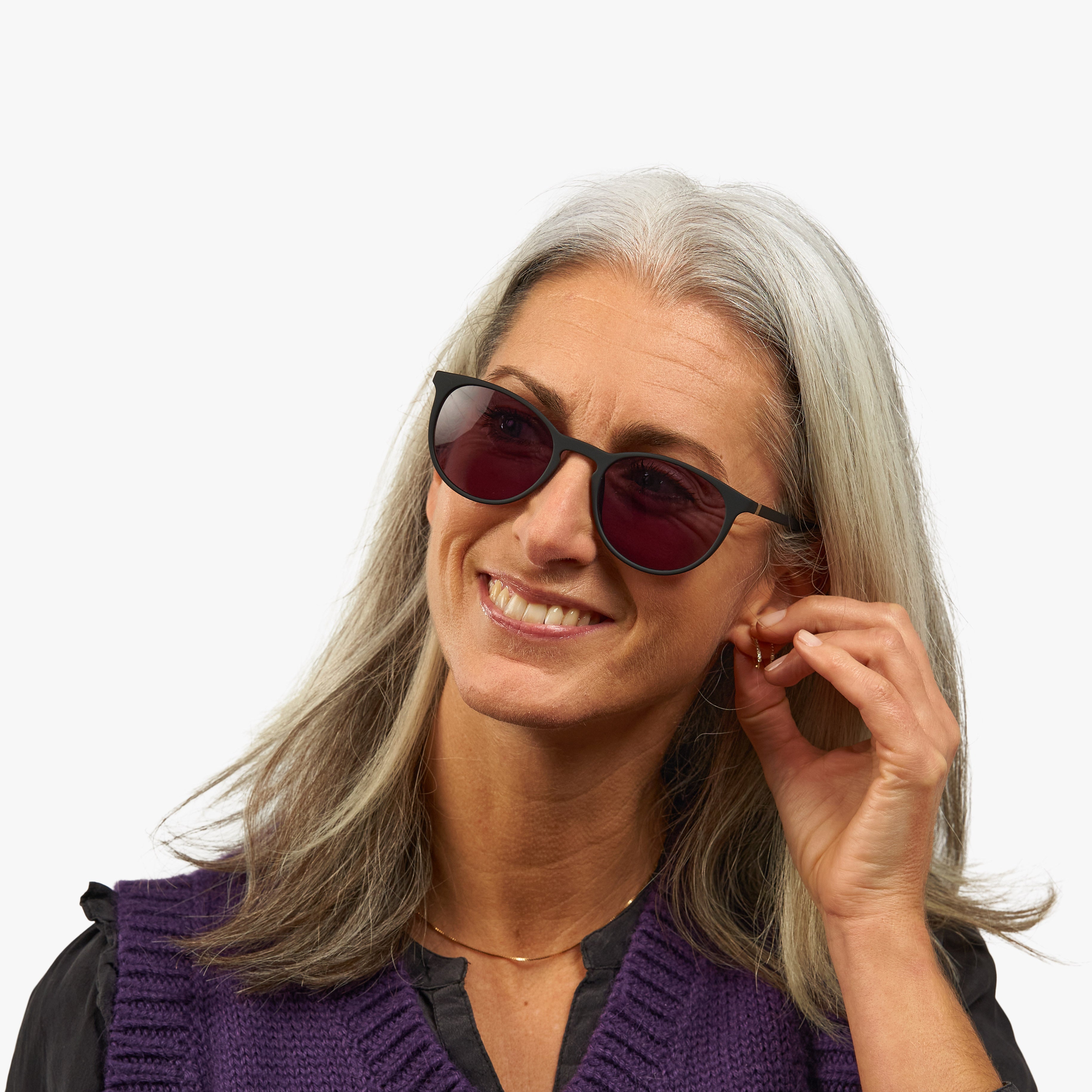 Person wearing Women's Stockholm Black sunglasses